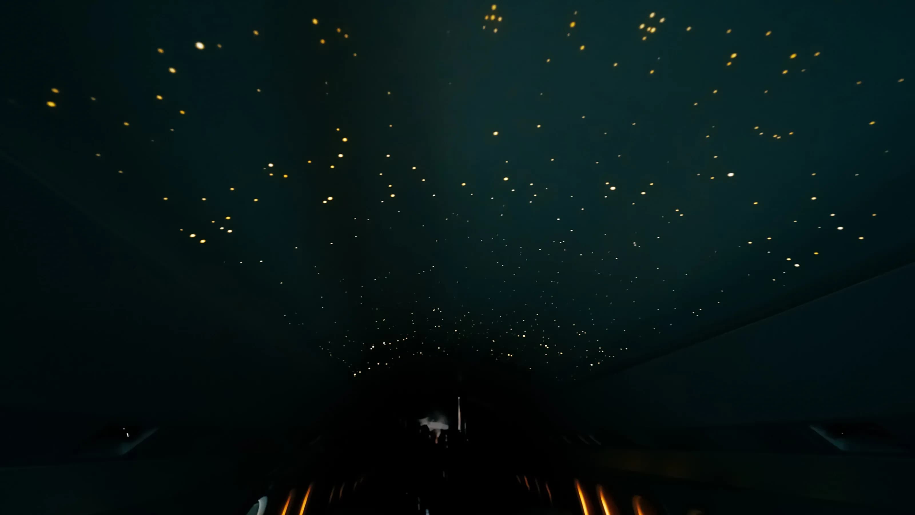 Falcon 2000 overhead lighting with contrasting blue and warm points in a darkened cabin.