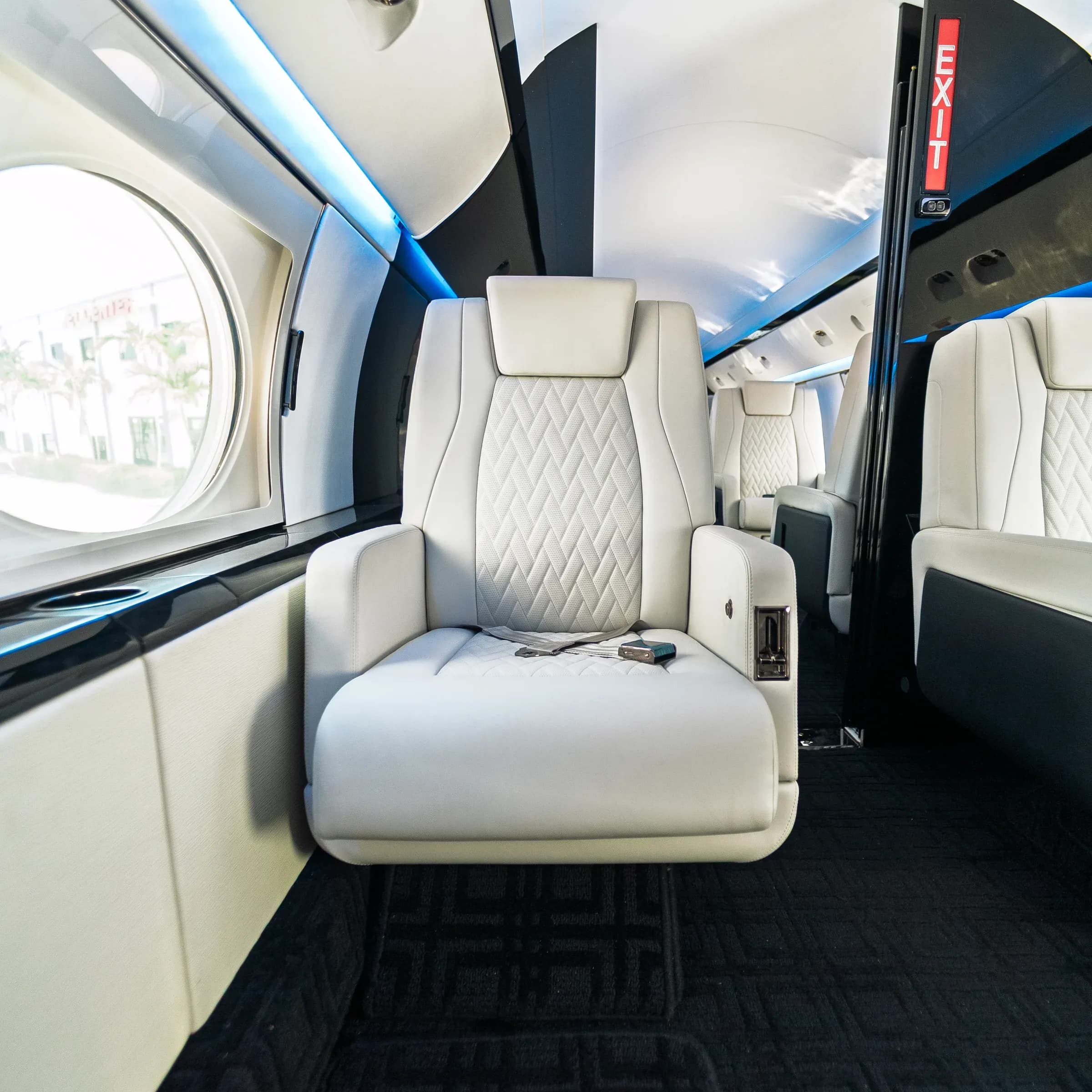 Full view of a white diamond-quilted Gulfstream G-IV seat.