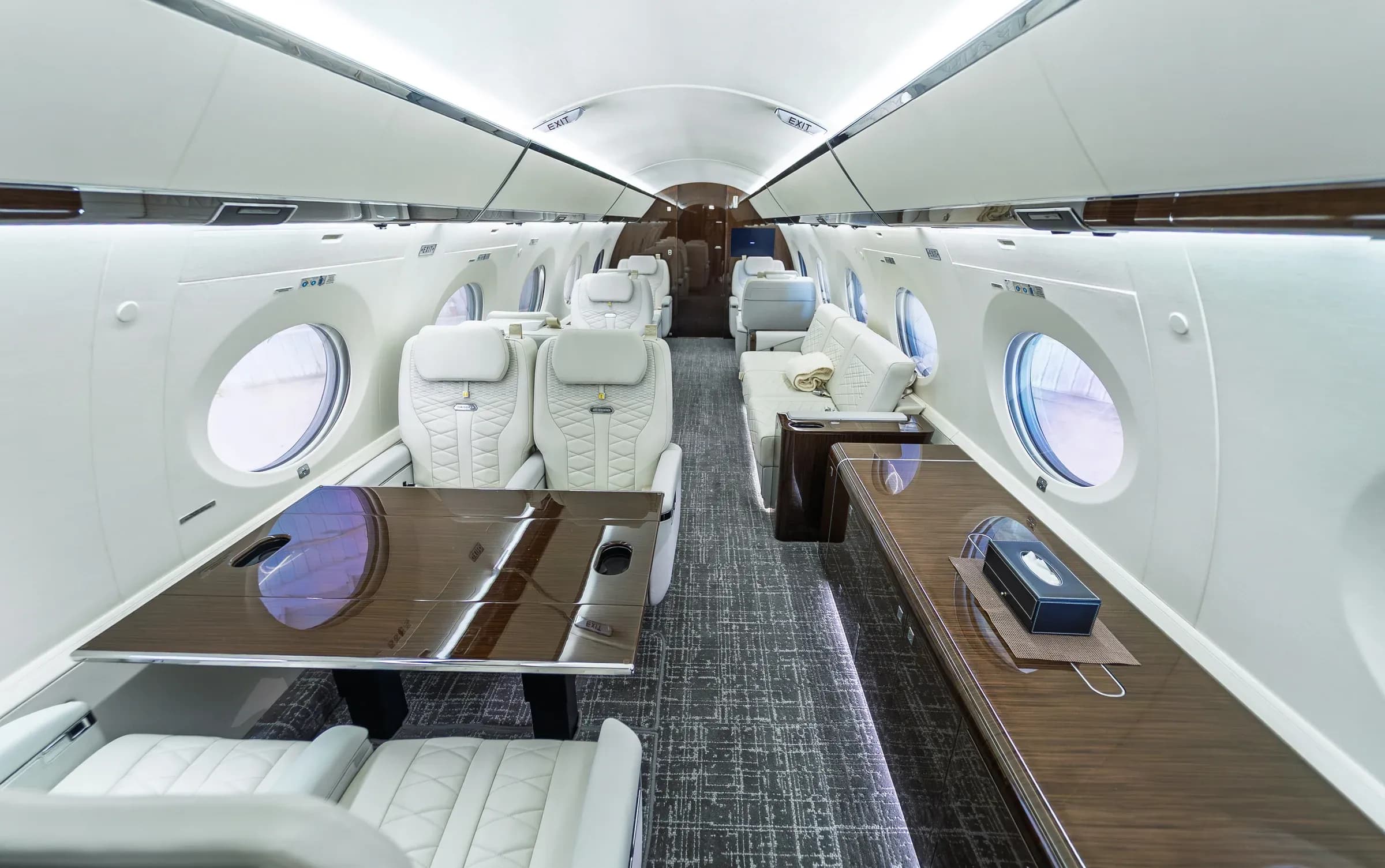 Elevated rear-corner view of the Gulfstream G650ER table and seating area.