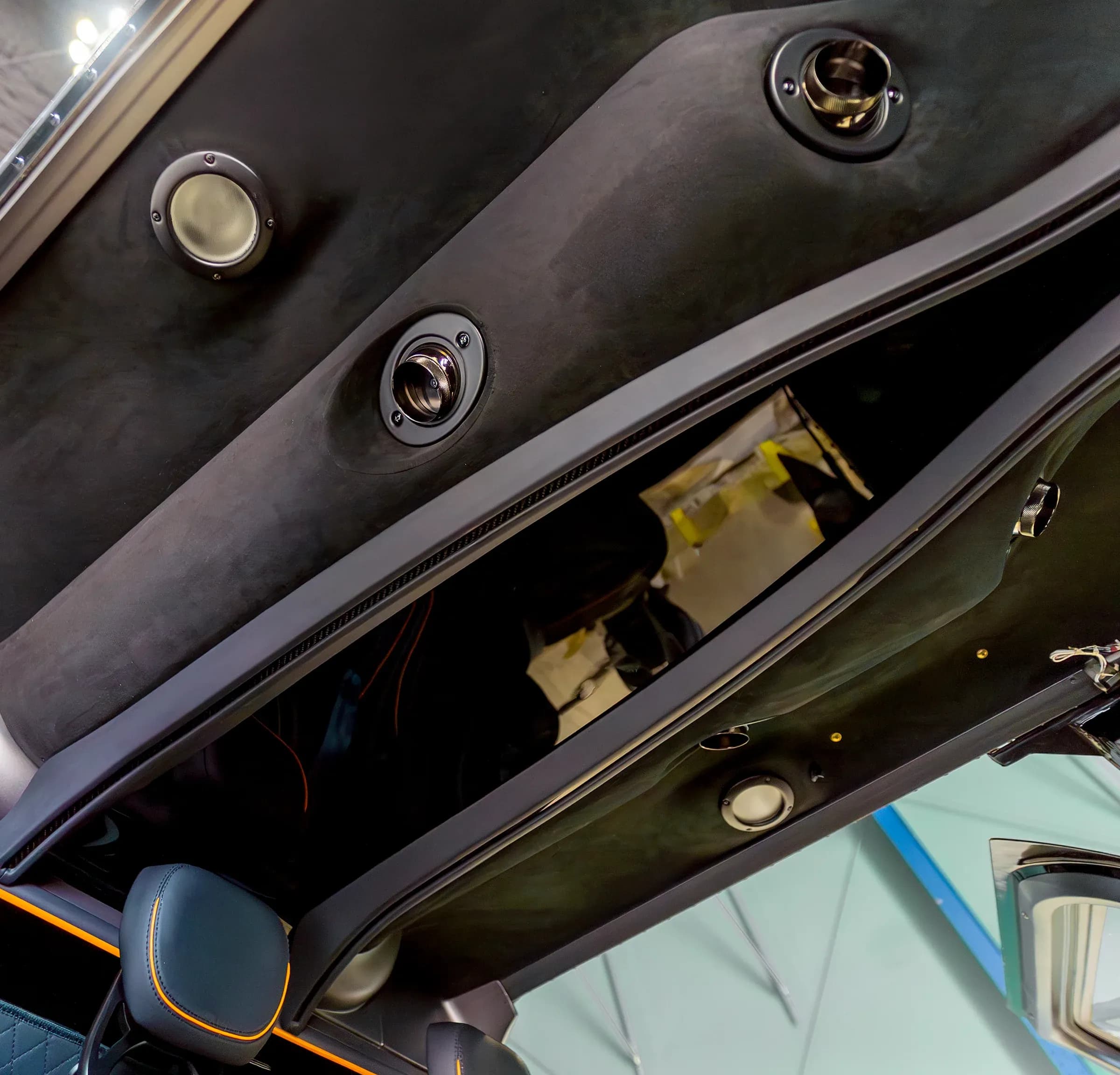 Bell 407 cabin roof lining with reading lights and a speaker.