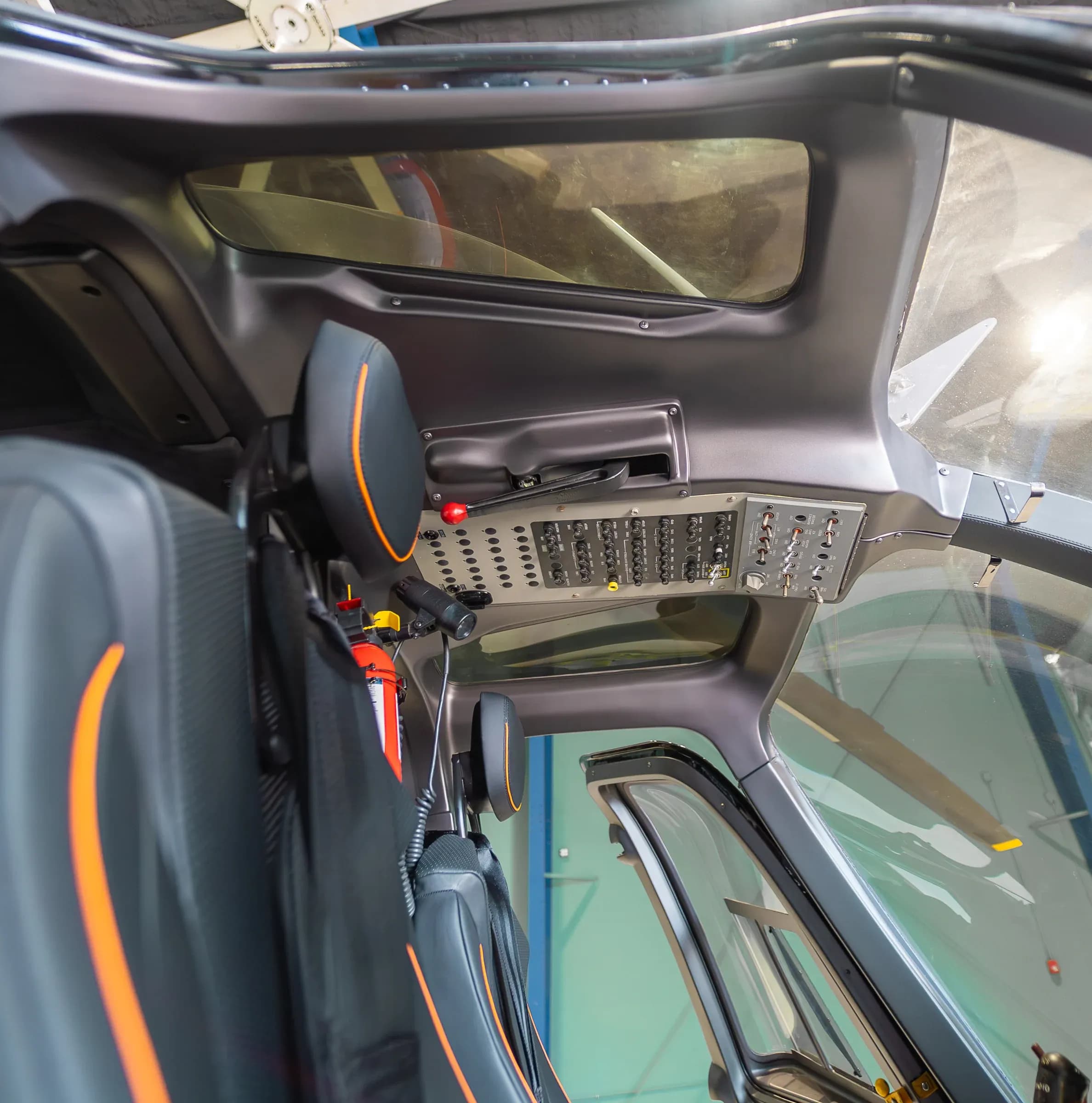Bell 407 headrest and cockpit roof panels beside the cabin windows.