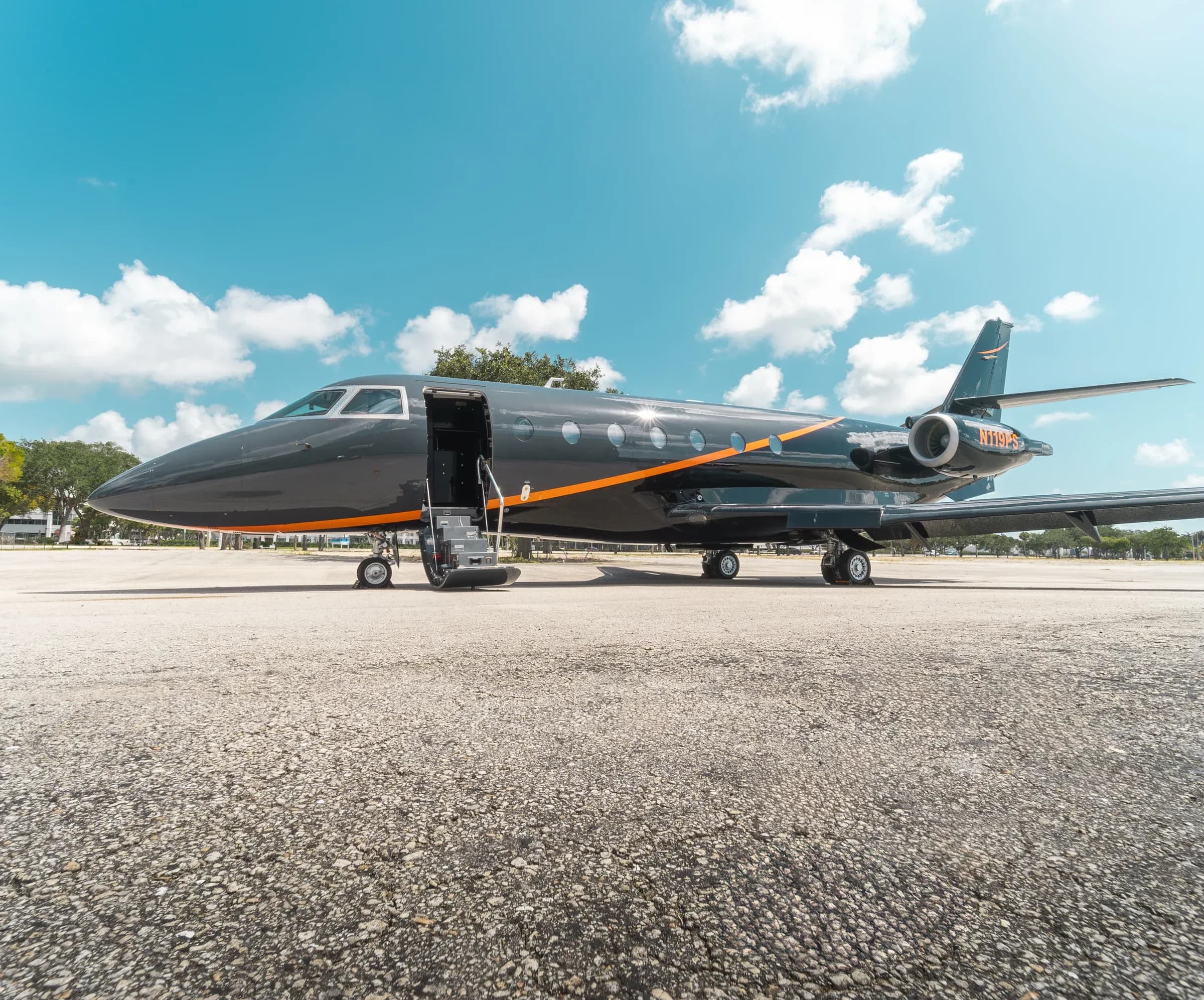 Side view of the Gulfstream G200 exterior with open entry stairs.