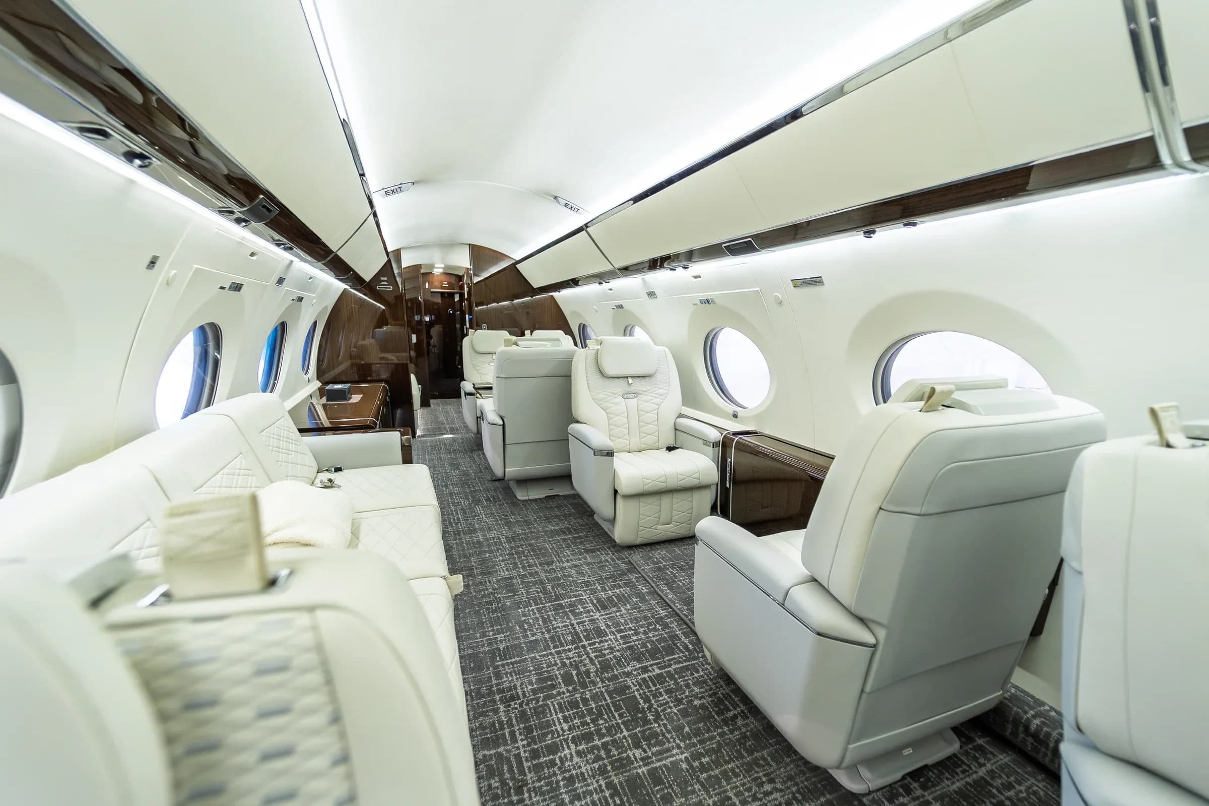Diagonal view through the Gulfstream G650ER seating areas and divan.