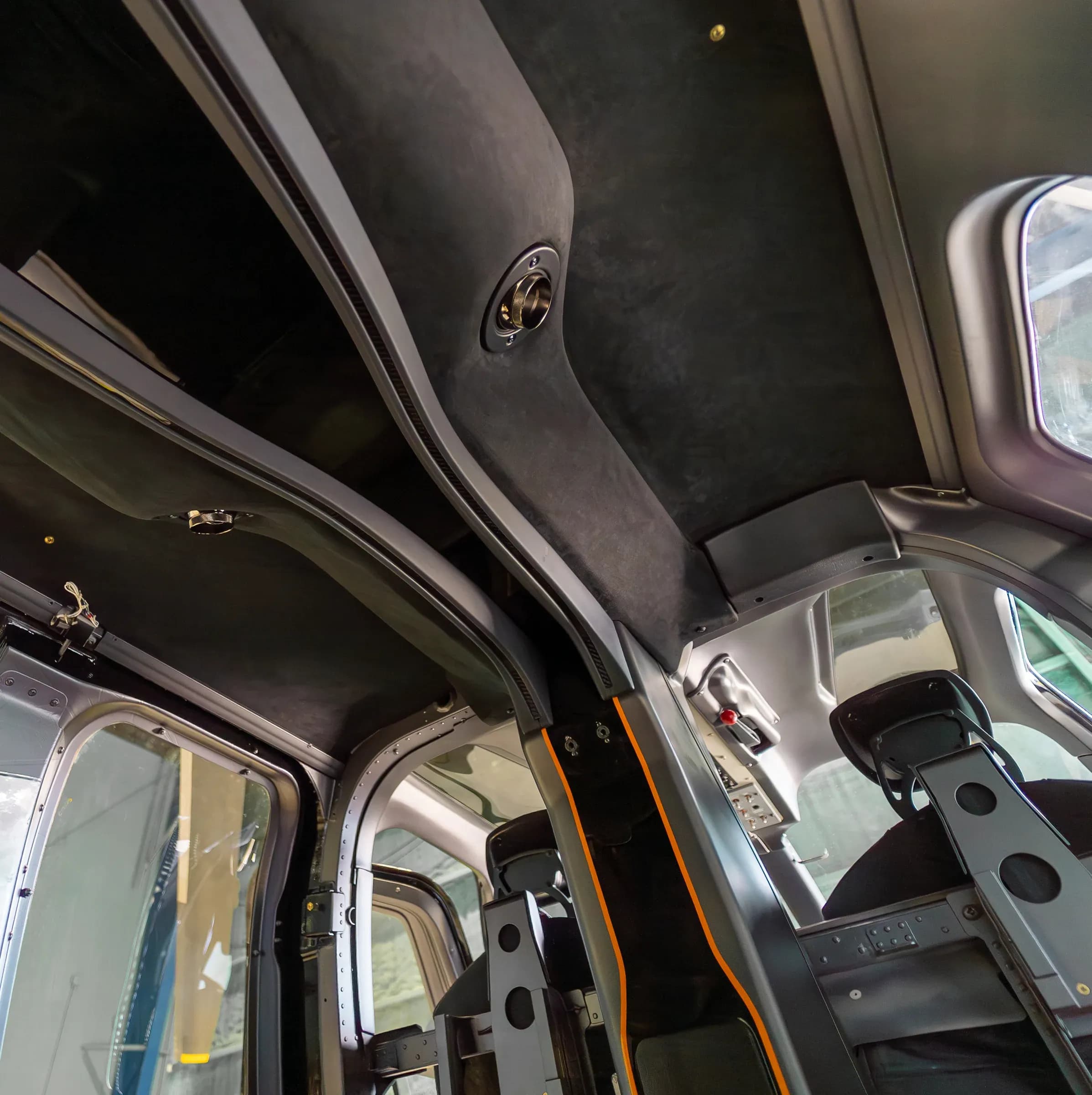 Bell 407 headliner and overhead lighting beside the cockpit windows.