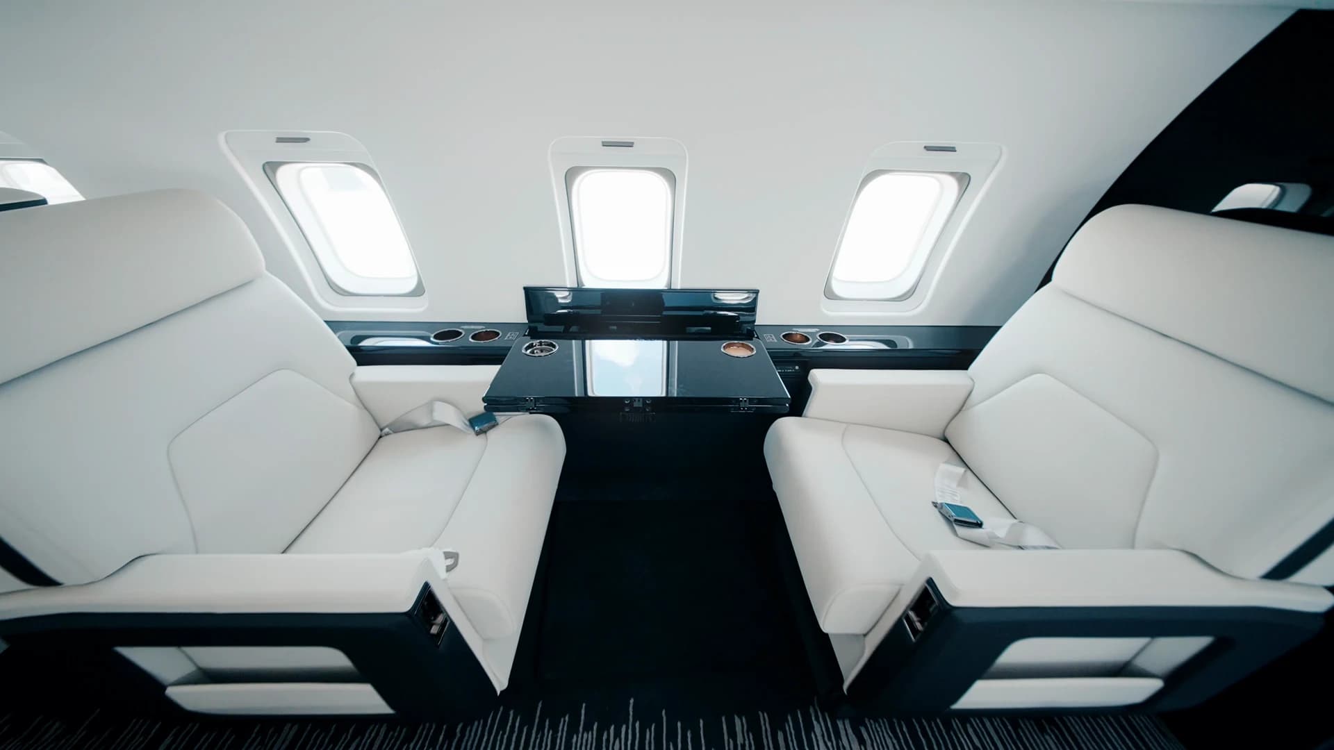 Challenger 604 club seating with table.