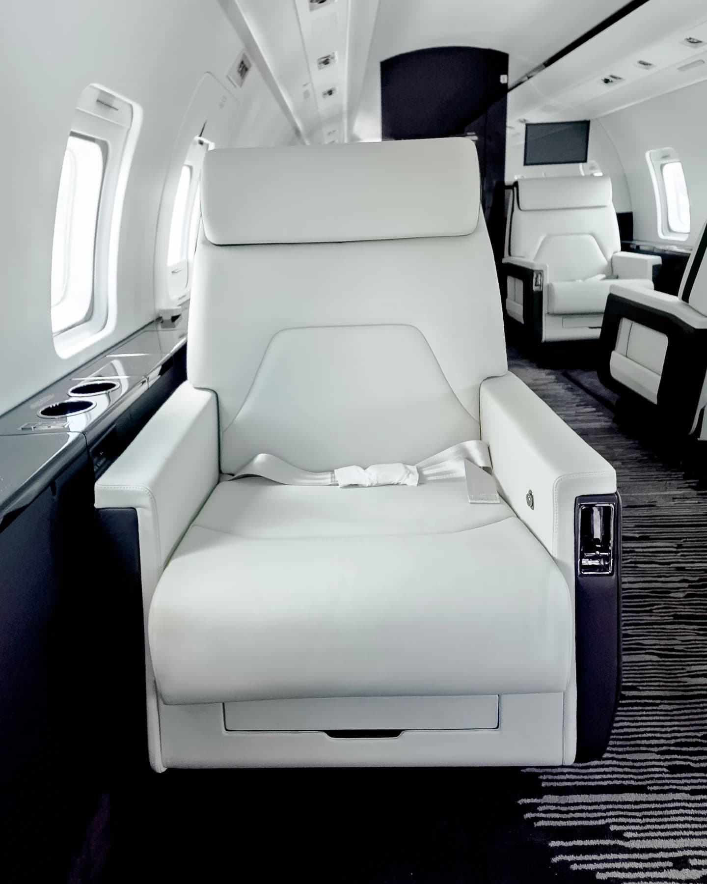 Ivory Challenger 604 seat with tailored panel seams, dark arm surrounds and its original seat belt.