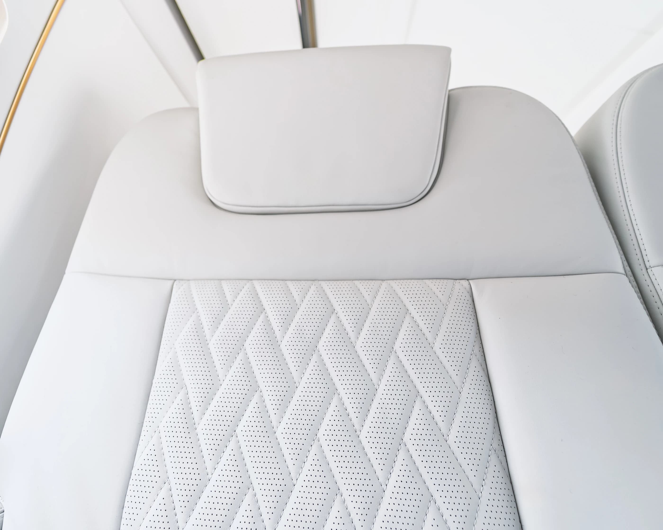 Gulfstream G550 headrest and the original perforated, stitched upholstery insert.