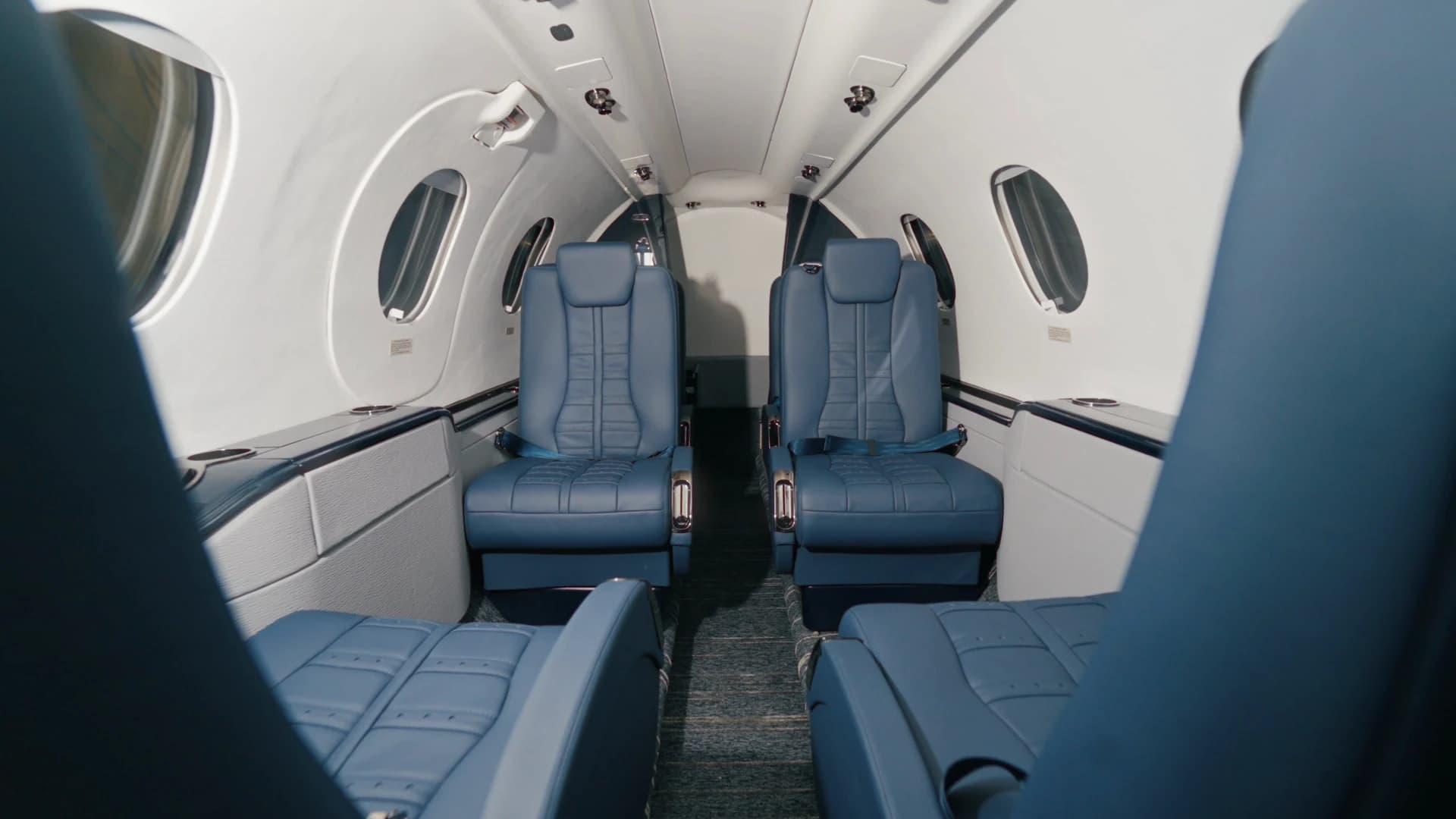 Hawker 400 cabin view along the aisle.
