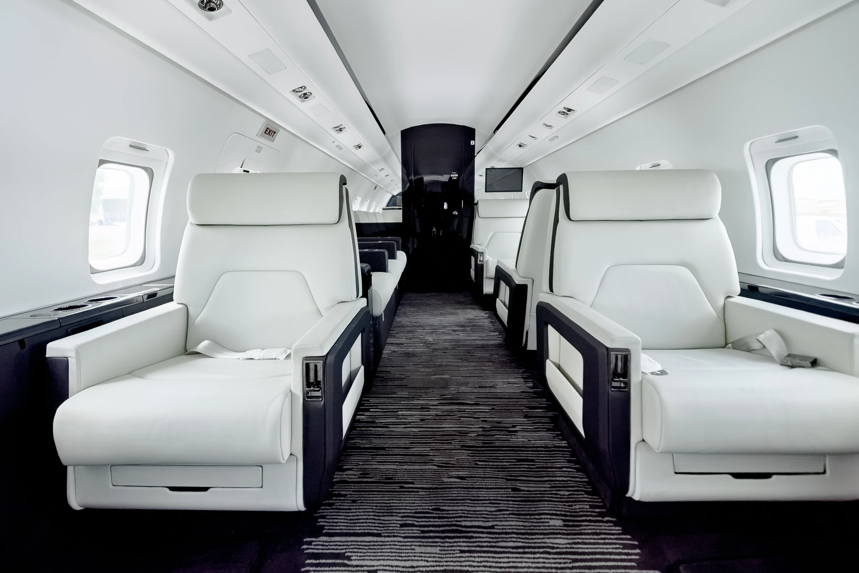 Official photograph of the completed Rex Challenger 604 cabin with pale upholstery and contrasting dark details