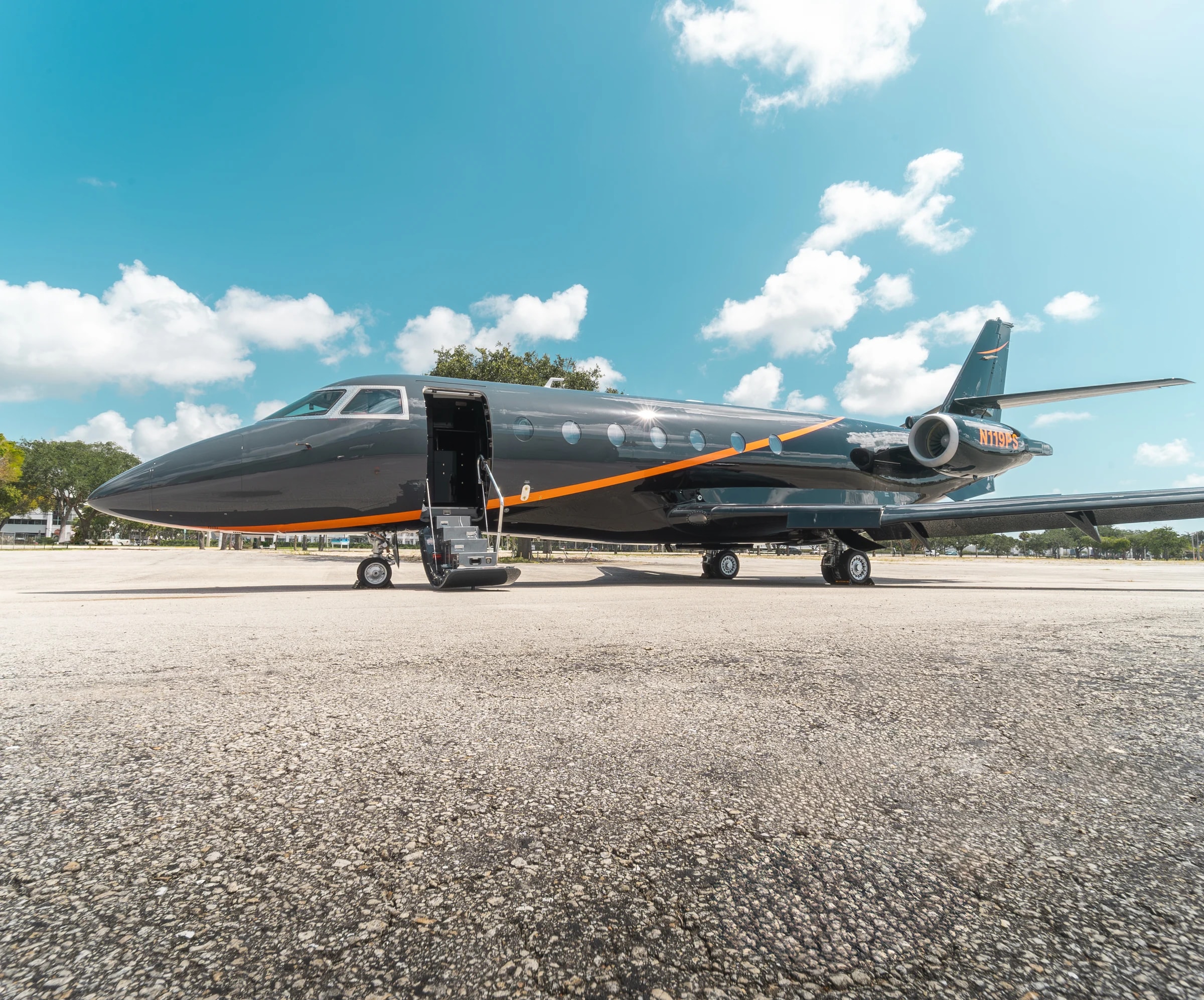 Side view of the Gulfstream G200 exterior with open entry stairs.